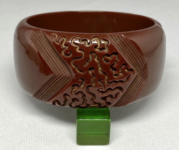 BB235 wide chocolate brown curlicue carved bakelite bangle